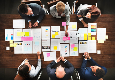 People around a table planning