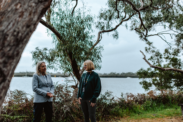 Two environmental officers conversing outdoors